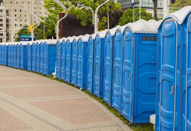 hygienic portable restrooms lined up at a music festival, providing comfort and convenience for attendees in Alhambra